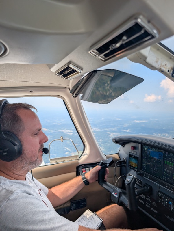 Philip flying a Piper