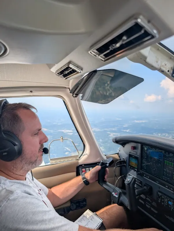 Philip flying a Piper